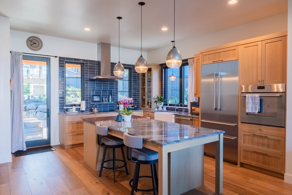 Custom kitchen with wood cabinetry and island seating