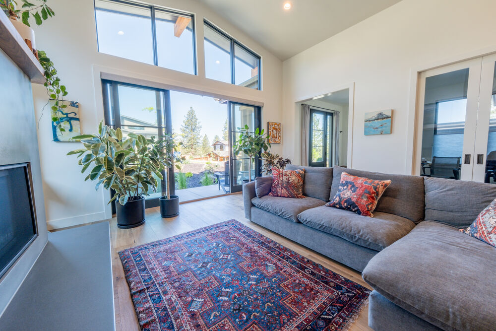 Living area framed by floor-to-ceiling glass